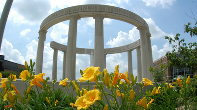 the colonnade in the background with flowers in the foreground